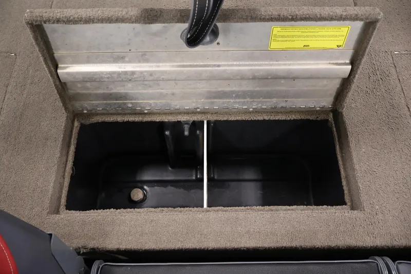 Slide: The Image of Open storage compartment in 2003 Tracker Pro Team 175 boat, featuring carpeted interior. - 34