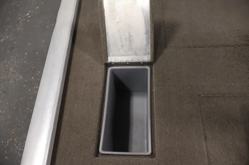 Slide: The Image of Storage compartment in 2003 Tracker Pro Team 175 boat, featuring carpeted interior. - 36