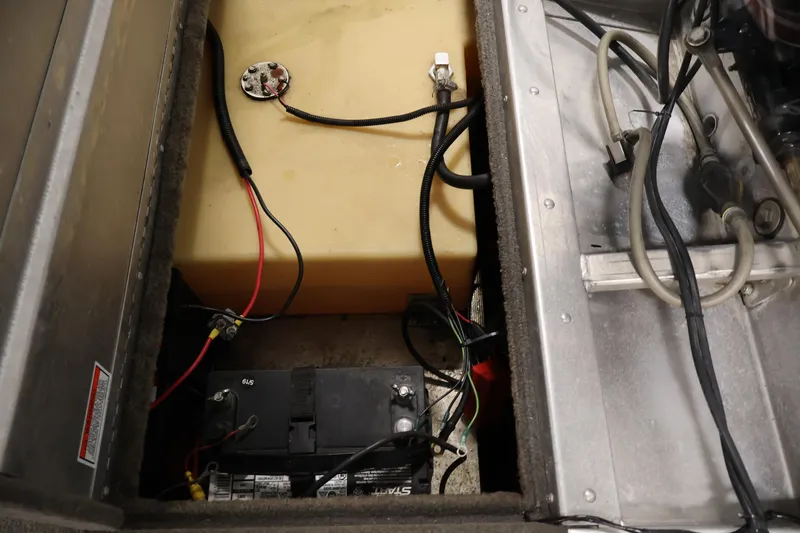 Slide: The Image of 2003 Tracker Pro Team 175 boat battery and wiring compartment. - 38