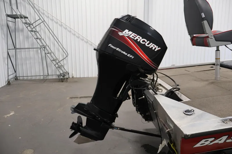 Slide: The Image of 2003 Tracker Pro Team 175 boat with Mercury FourStroke EFI outboard motor in a garage. - 40