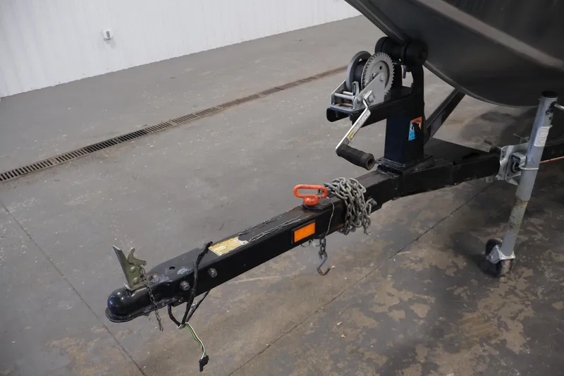 Slide: The Image of Trailer hitch of a 2003 Tracker Pro Team 175 boat in a garage setting. - 43