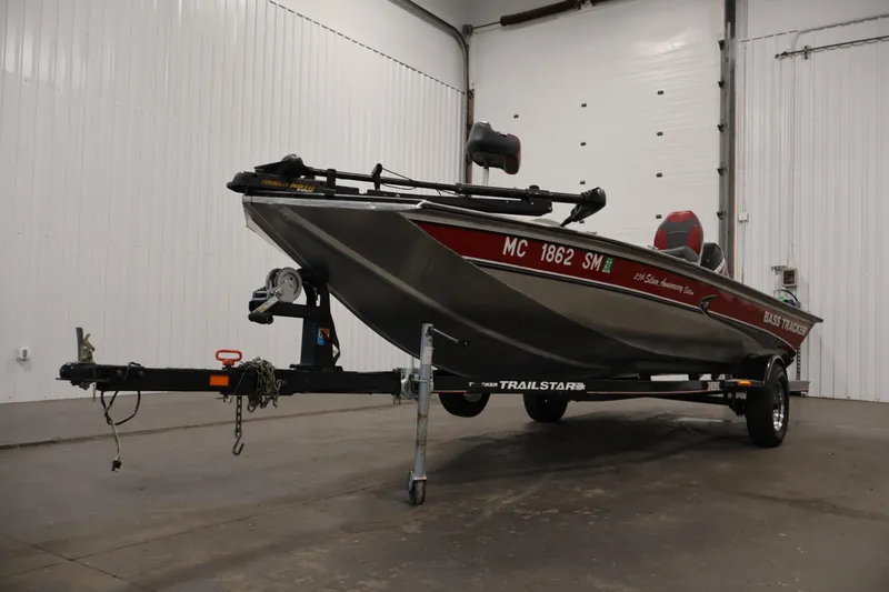 Slide: The Image of 2003 Tracker Pro Team 175 boat on trailer in indoor storage facility. - 44