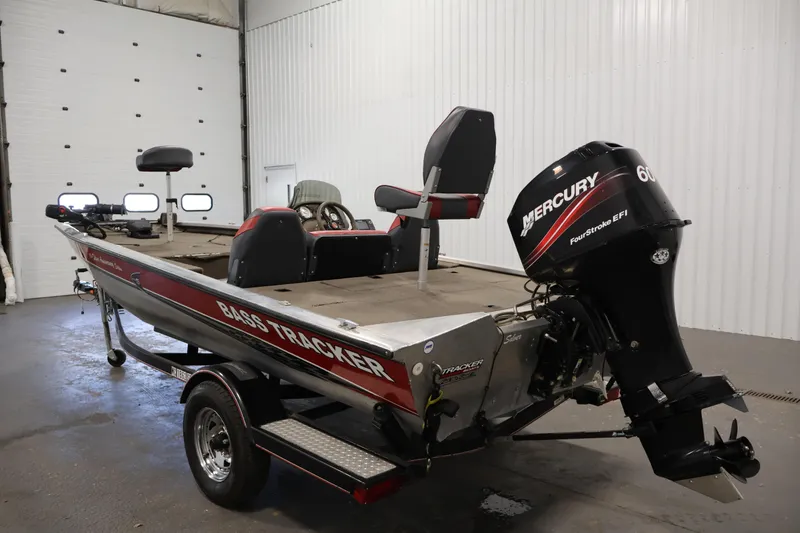 Slide: The Image of 2003 Tracker Pro Team 175 boat with Mercury engine in a garage setting. - 7