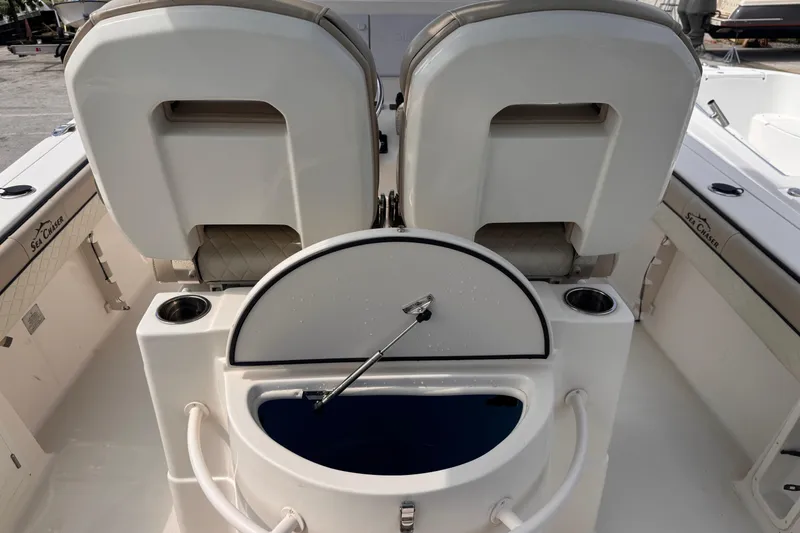 Slide: The Image of 2022 Sea Chaser 27 HFC CC boat interior with seating and storage compartments. - 10