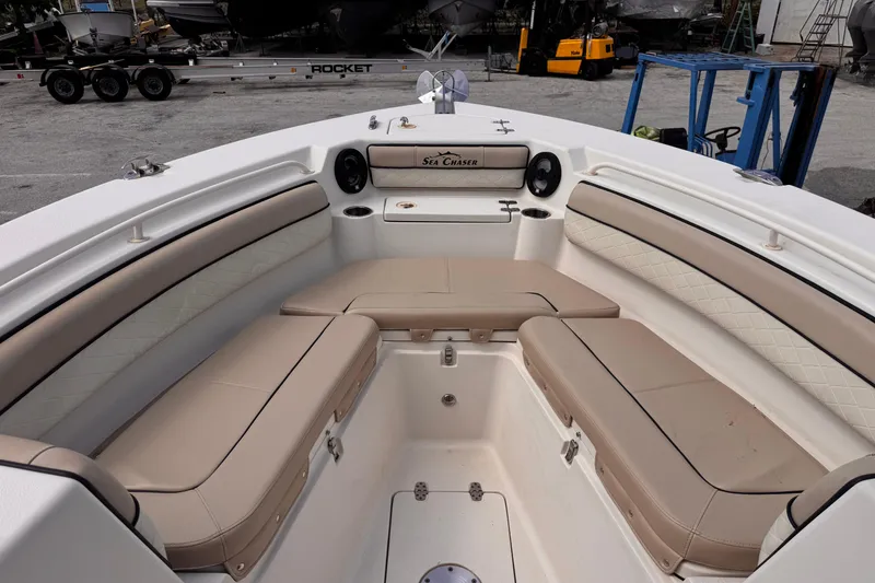 Slide: The Image of Interior view of 2022 Sea Chaser 27 HFC CC boat with beige seating. - 17