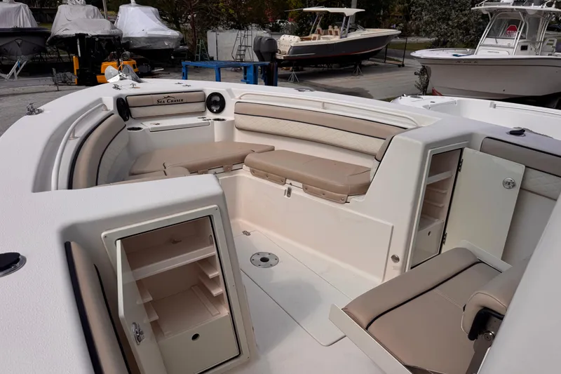 Slide: The Image of 2022 Sea Chaser 27 HFC CC boat interior with seating and storage compartments. - 18