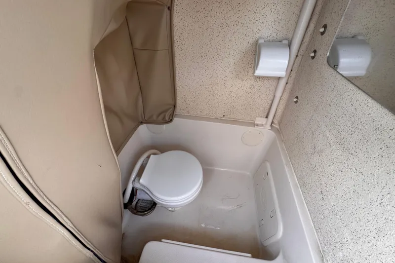 Slide: The Image of Interior of 2022 Sea Chaser 27 HFC CC boat bathroom with toilet and storage. - 20