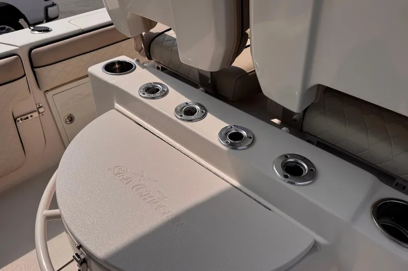 Slide: The Image of Interior view of 2022 Sea Chaser 27 HFC CC boat with rod holders and seating. - 23