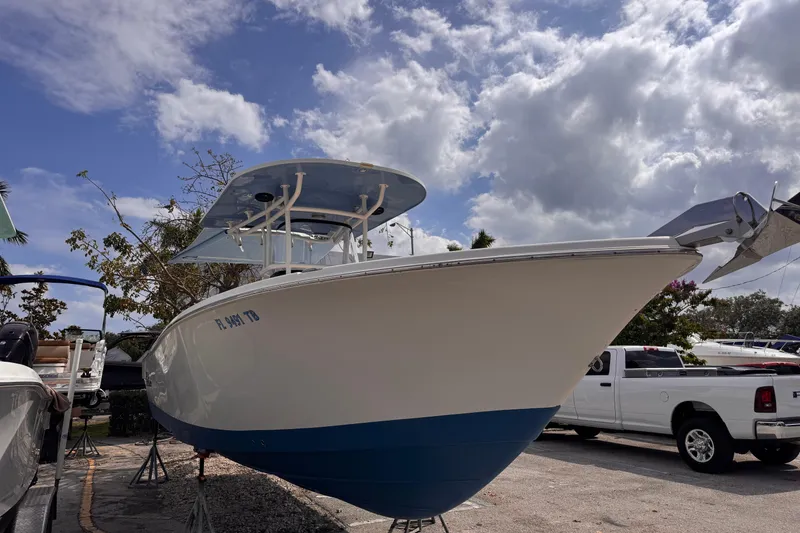 Slide: The Image of 2022 Sea Chaser 27 HFC CC boat on display under a cloudy sky. - 4