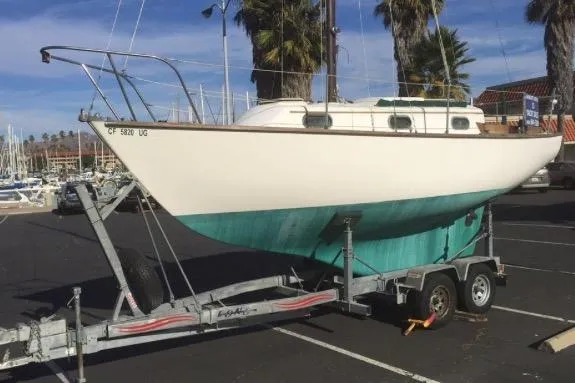 Slide: The Image of 1986 Cape Dory 26 sailboat on trailer in marina parking lot. - 12