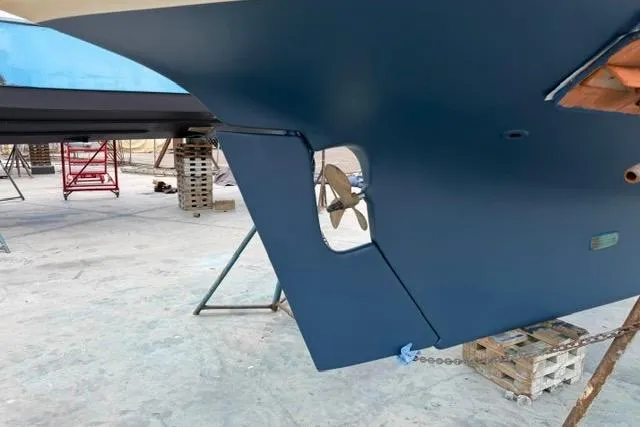 Slide: The Image of 1986 Cape Dory Sloop sailboat hull and propeller in dry dock. - 18