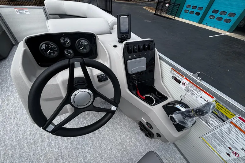 Slide: The Image of Steering console of 2026 Princecraft Vectra 21 RL pontoon boat with gauges and controls. - 7