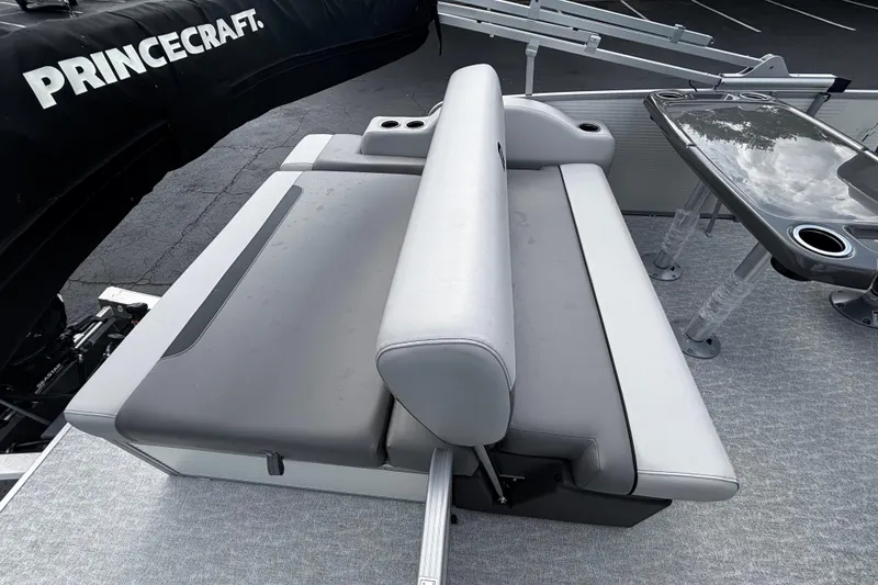 Slide: The Image of 2026 Princecraft Vectra 21 RL boat interior with gray seating and table. - 8