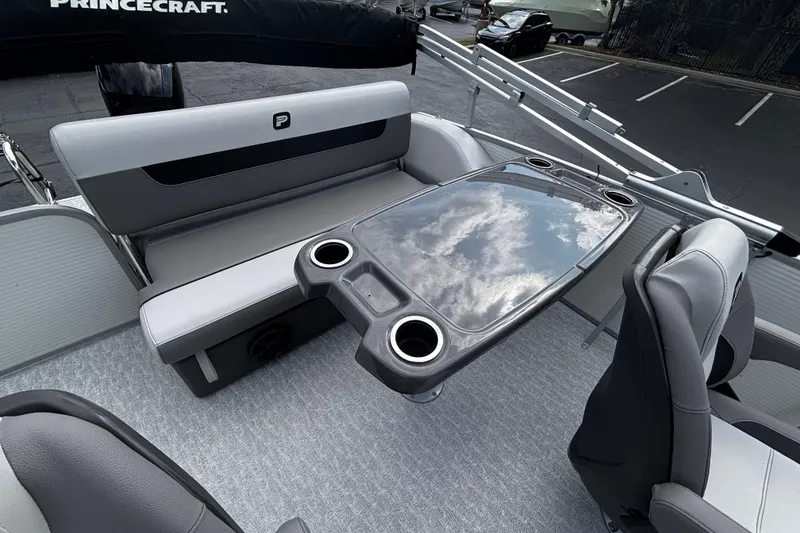 Slide: The Image of 2026 Princecraft Vectra 21 RL boat interior with sleek seating and modern table design. - 9