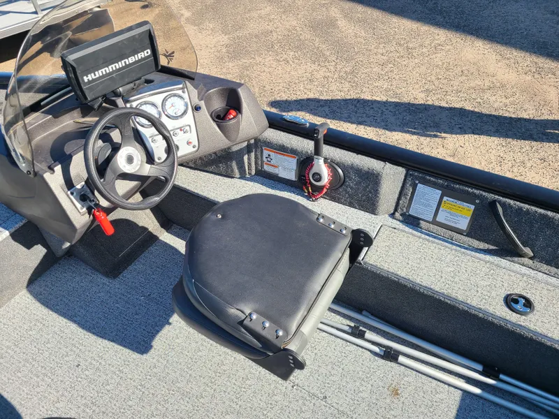Slide: The Image of Interior of 2023 Tracker Pro Guide V16 SC boat with steering console. - 11