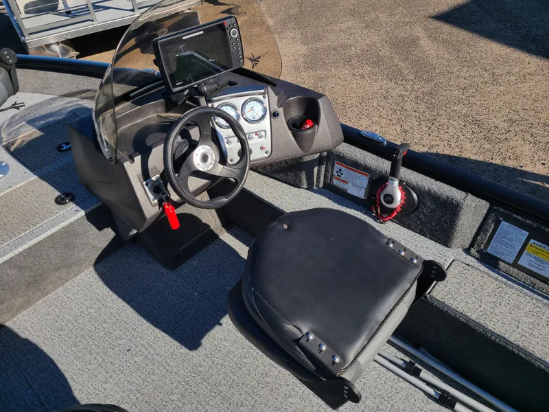 Slide: The Image of Interior of a 2023 Tracker Pro Guide V16 SC boat. - 12