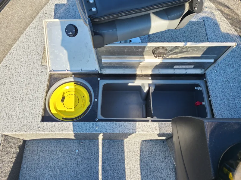 Slide: The Image of 2023 Tracker Pro Guide V16 SC boat interior with storage compartment. - 17