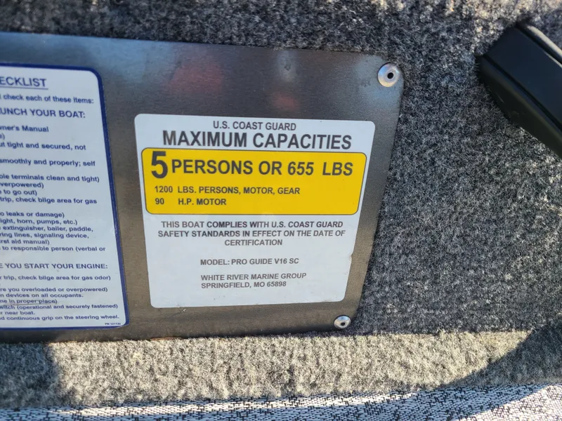 Slide: The Image of USCG capacity label for Tracker Pro Guide V16 SC boat. - 20