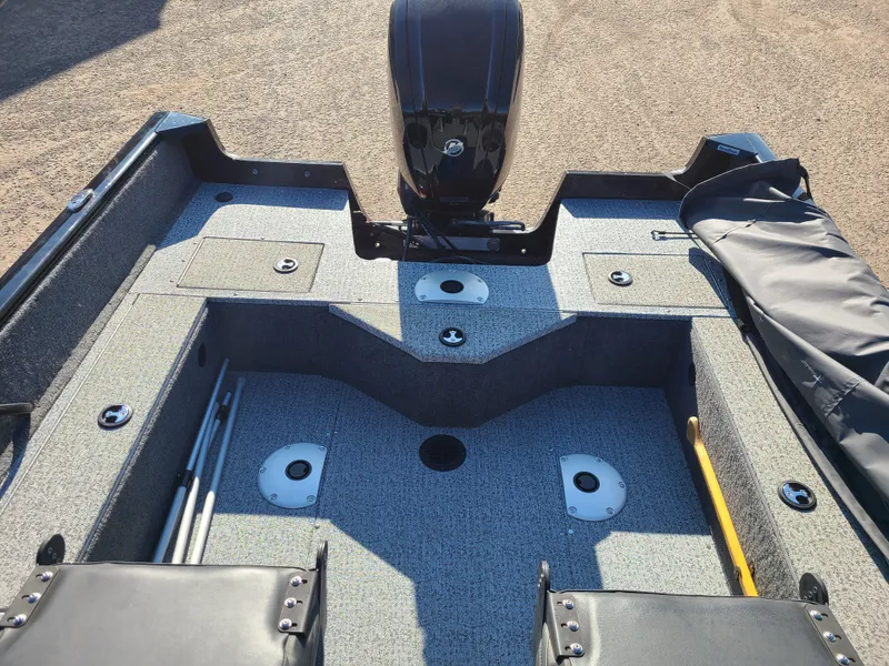Slide: The Image of 2023 Tracker Pro Guide V16 SC boat interior with 75HP Mercury engine. - 8
