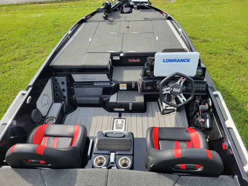 Slide: The Image of Interior of 2025 Bass Cat Jaguar with modern seating and controls. - 12