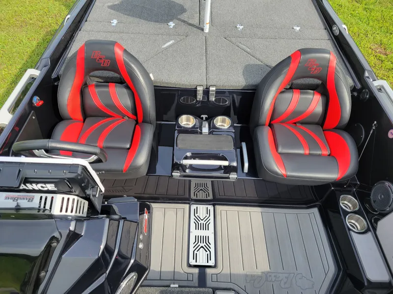 Slide: The Image of Interior of 2025 Bass Cat Jaguar with red and black seats. - 15