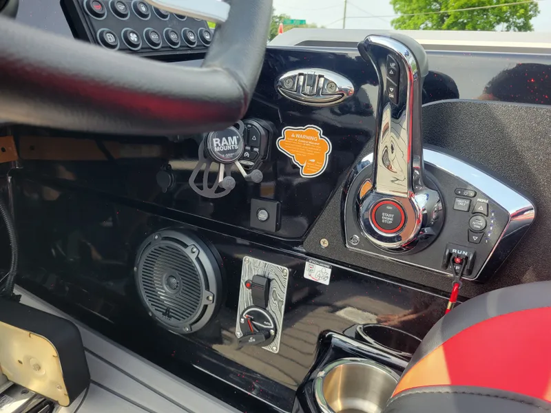 Slide: The Image of Interior of 2025 Bass Cat Jaguar with controls and speaker. - 16