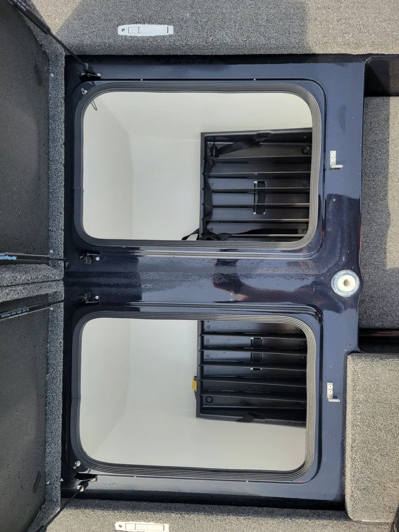 Slide: The Image of Interior of 2025 Bass Cat Jaguar boat with storage compartments. - 21