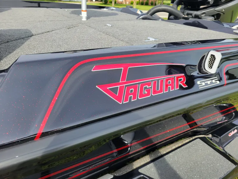 Slide: The Image of 2025 Bass Cat Jaguar boat with red logo and STS emblem. - 3
