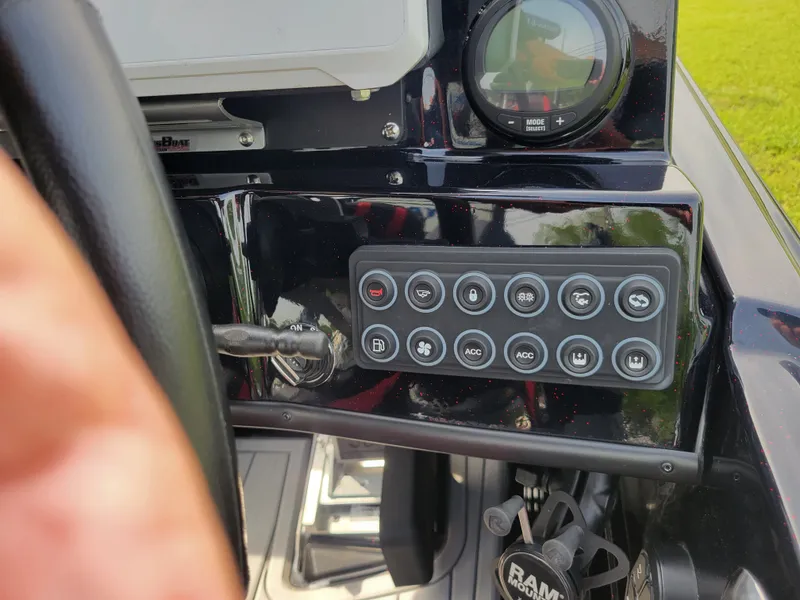 Slide: The Image of Dashboard of 2025 Bass Cat Jaguar with switches and controls. - 31