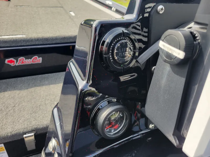 Slide: The Image of 2025 Bass Cat Jaguar dashboard with instruments and logo. - 33
