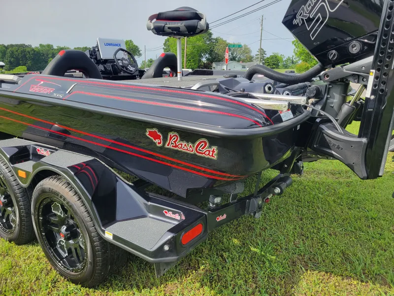 Slide: The Image of 2025 Bass Cat Jaguar boat parked on green grass. - 4