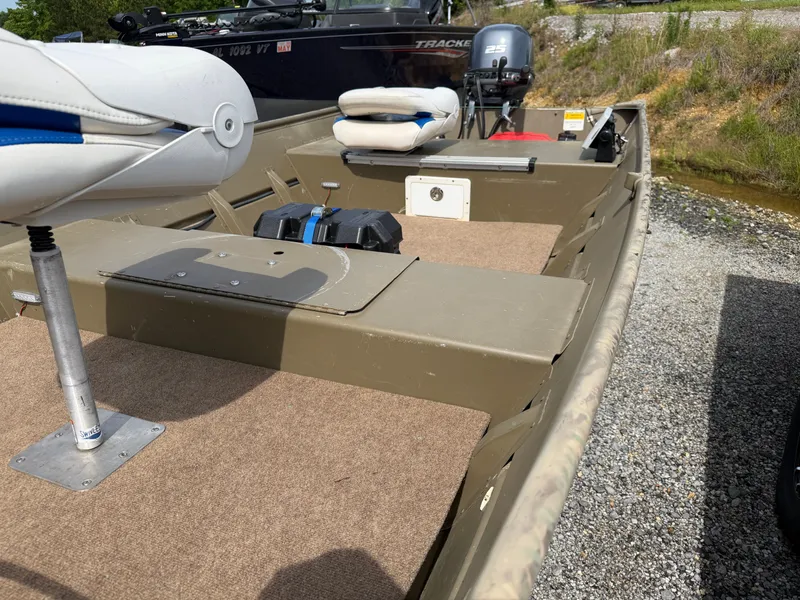 Slide: The Image of 2016 G3 1544 Jon boat with seating and motor on gravel path. - 11