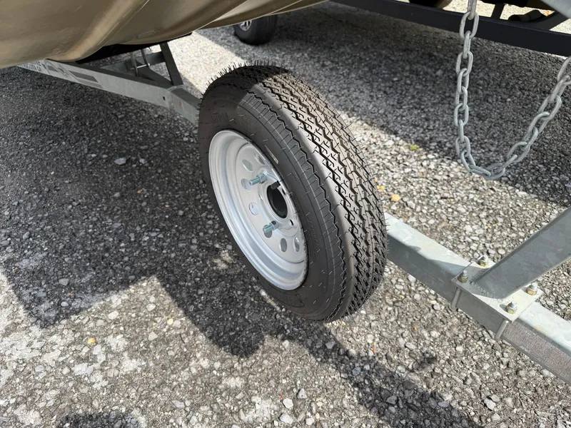 Slide: The Image of Close-up of a 2016 G3 1544 Jon boat trailer wheel. - 12