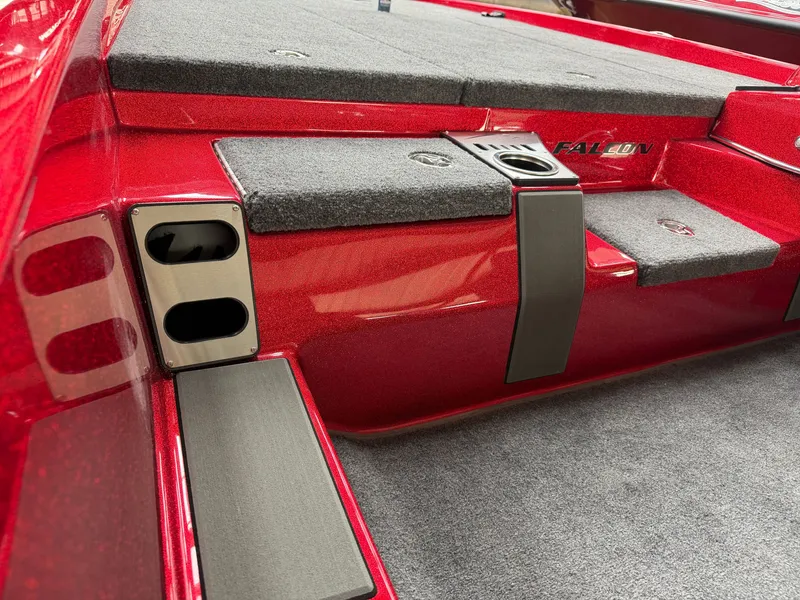 Slide: The Image of Falcon F195 2026, red boat, gray carpeted surface, cup holder. - 13
