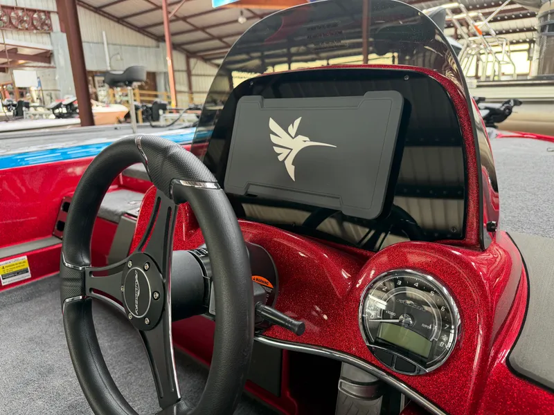 Slide: The Image of Interior of Falcon F195 boat, 2026 model, featuring steering wheel and dashboard. - 16
