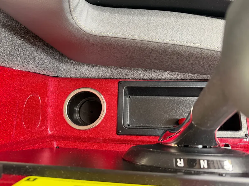 Slide: The Image of Interior of 2026 Falcon F195 with gear shift and cup holder. - 18