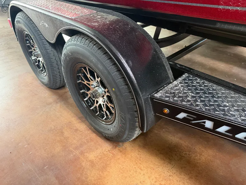 Slide: The Image of Falcon F195 trailer 2026 with sturdy tires and metal fender. - 23