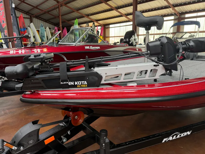 Slide: The Image of Falcon F195 boat 2026 with Minn Kota Ultrex motor in red color. - 9