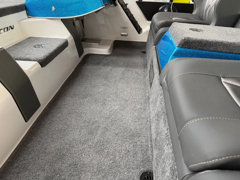 Slide: The Image of Interior of Falcon F195 boat, 2026 model, featuring gray carpet and blue accents. - 14