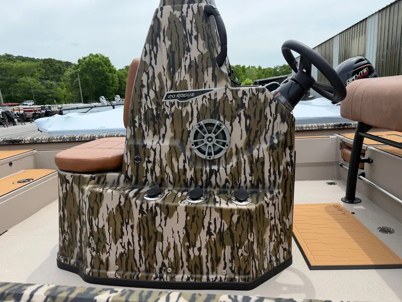 Slide: The Image of Avid 20CC Rogue 2026 boat with camouflage pattern and steering console. - 11
