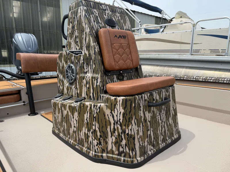 Slide: The Image of Avid 20CC Rogue 2026 boat with camouflage design and cushioned seat. - 13
