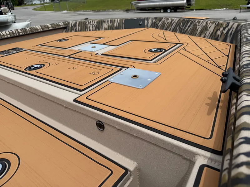 Slide: The Image of Avid 20CC Rogue 2026 boat deck with storage and measuring scale. - 16