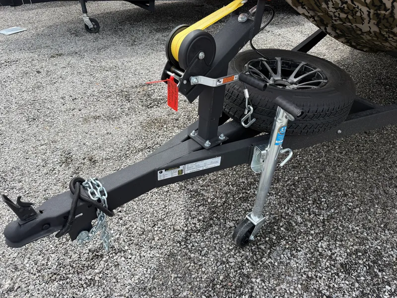 Slide: The Image of Avid 20CC Rogue 2026 trailer with spare tire and chains. - 20