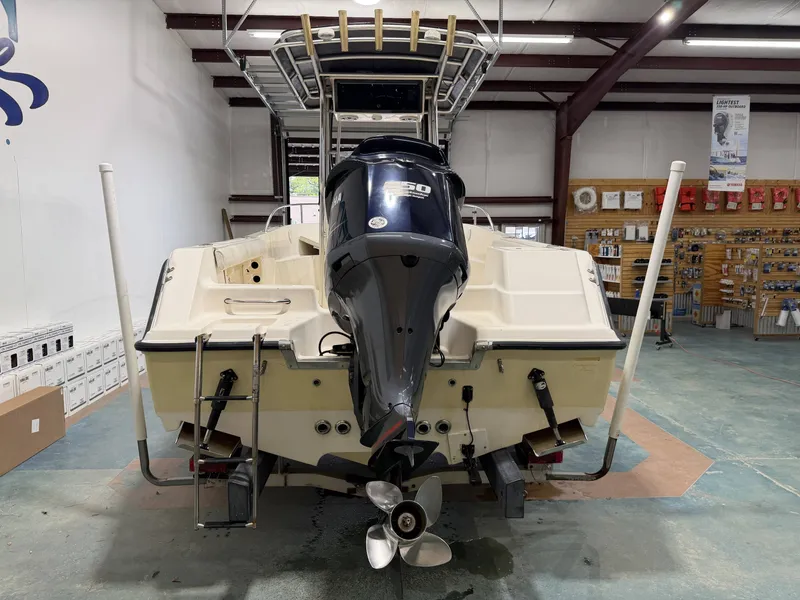 Slide: The Image of 2005 Key West 225 boat with outboard motor in a workshop. - 3