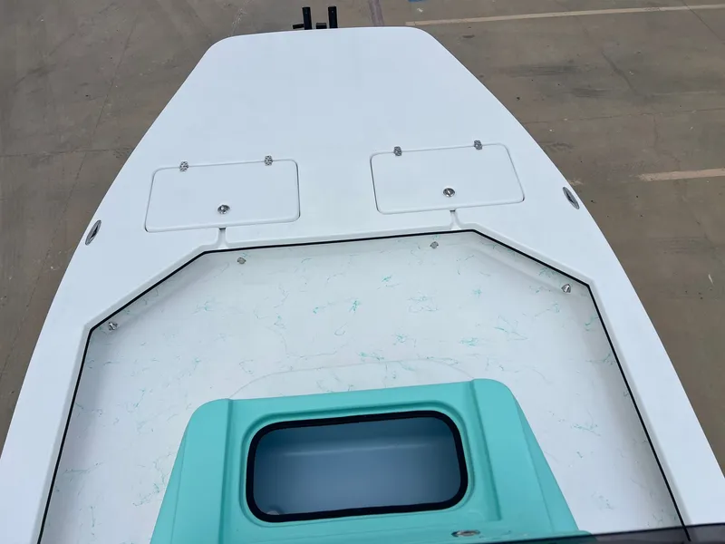 Slide: The Image of Deck of a 2026 Shoalwater 23' Catamaran with storage hatches. - 14