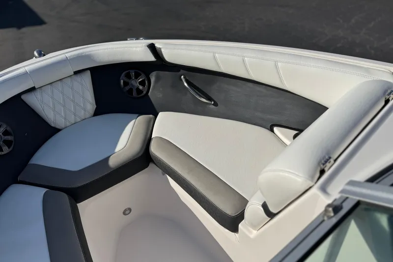Slide: The Image of Luxurious seating area of a 2019 Regal 21 OBX boat with stylish upholstery. - 13