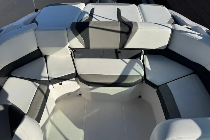 Slide: The Image of 2019 Regal 21 OBX boat interior with white and gray seating arrangement. - 15