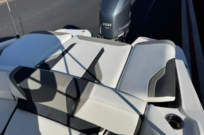 Slide: The Image of 2019 Regal 21 OBX boat with Yamaha 150 engine, featuring sleek white and gray seating. - 18