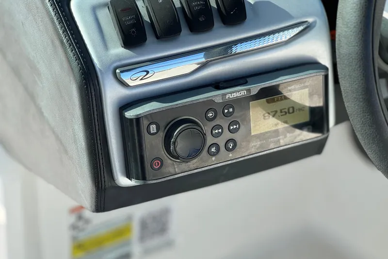 Slide: The Image of Control panel of a 2019 Regal 21 OBX boat featuring a Fusion stereo system. - 25