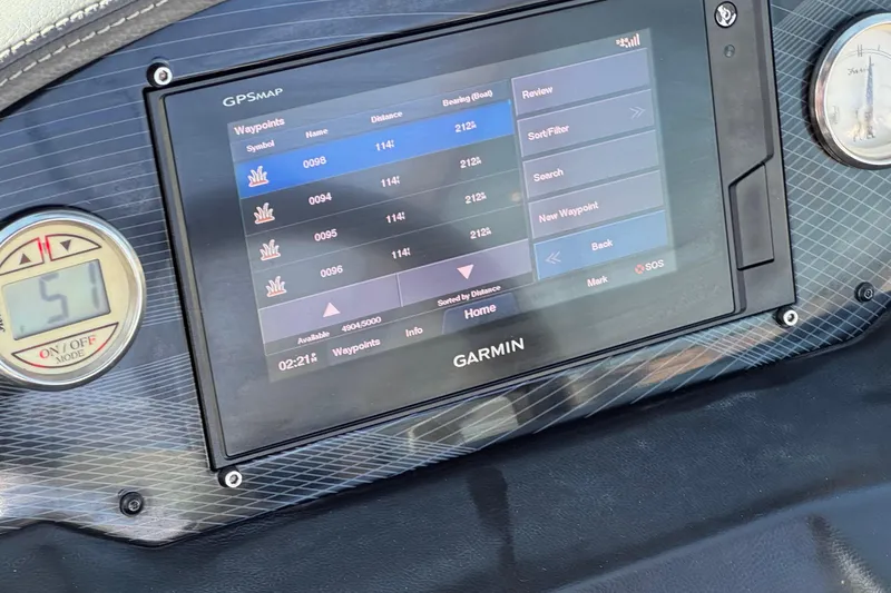 Slide: The Image of Garmin GPS display on 2019 Regal 21 OBX boat dashboard, showing waypoints and speedometer. - 27